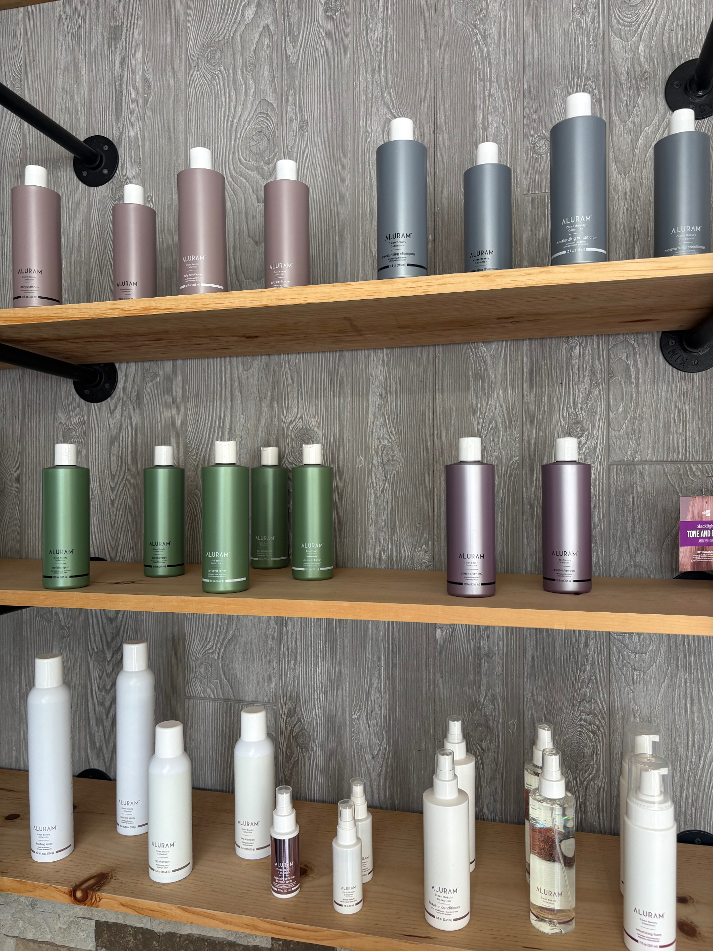 Aluram Clean Beauty product shelves at Premiere Studios